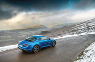 Alpine A110 parked on a mountain road - rear