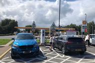 The Kia e-Niro meets a (diesel) BMW X6 in an electric charging bay