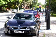 BMW i8 and Tesla Model S on street charging