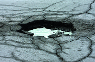 Pothole full of water