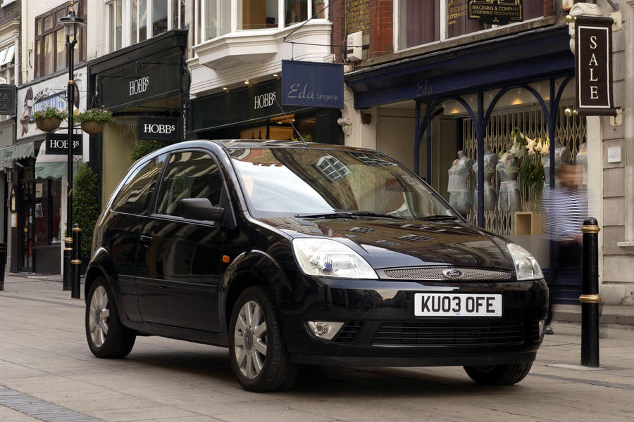 Black 2003 Ford Fiesta parked in front of shop on high street – front quarter